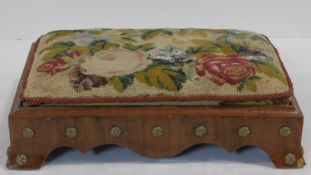 A 19th century walnut framed footstool with its original beaded floral tapestry drop in pad. H.10