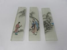 Three Qing dynasty Chinese reverse painted, opaque white glass backed bricks/scroll weights.
