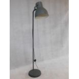 A contemporary vintage industrial style adjustable floor standing reading lamp. H.182cm