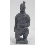 A Qin dynasty style terracotta kneeling archer figure. H.29cm