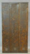 A vintage metal floor standing three section industrial locker. H.180 W.93 D.38cm