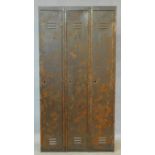 A vintage metal floor standing three section industrial locker. H.180 W.93 D.38cm