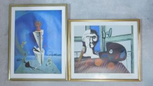 Two gilt framed and glazed posters, works by Salvador Dali and Picasso. 75x59cm