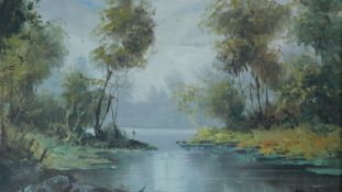 A gilt framed oil on canvas, river landscape, signed Mancini. 75x65cm