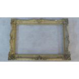 A Rococo style gesso picture frame. 77x110cm