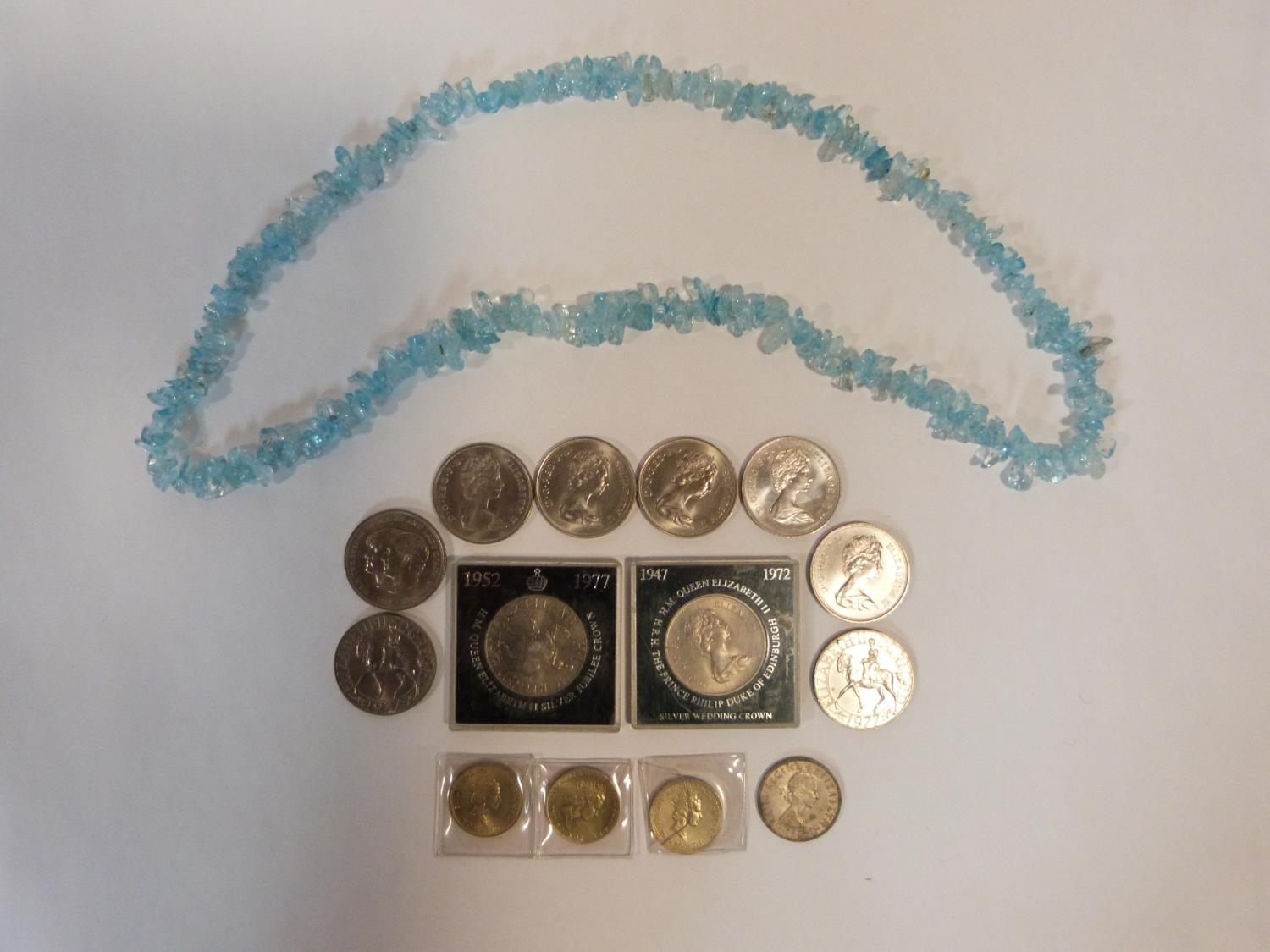 A collection of British coins together with a pale quartz chip necklace. Coins include an old