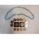 A collection of British coins together with a pale quartz chip necklace. Coins include an old