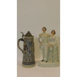 A 19th century Staffordshire flatback figure group and a lidded German stein. H.40cm