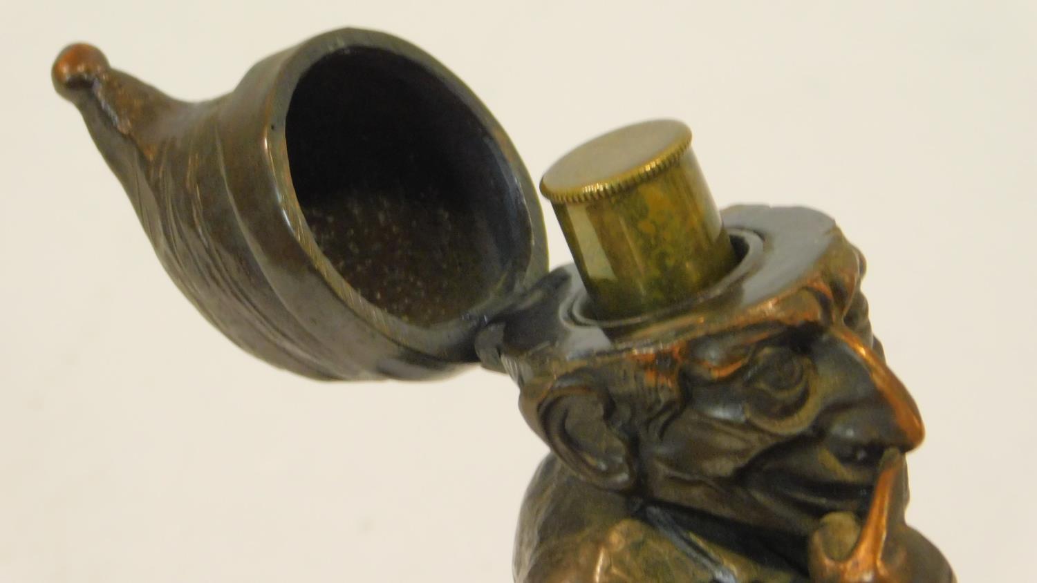 A vintage copper table lighter in the form of Mr Punch, hat is hinged and opens to show lighter. - Image 4 of 5