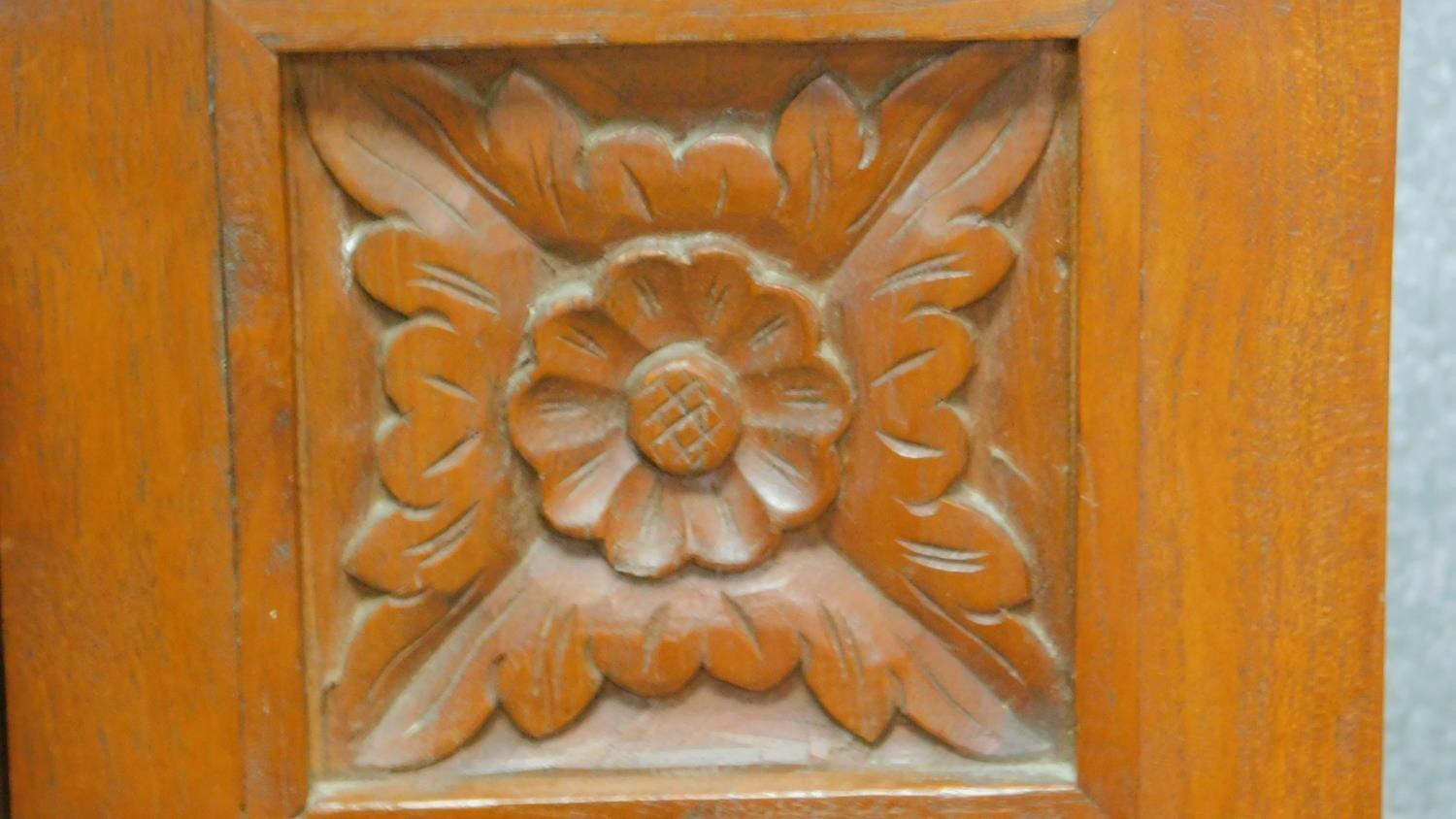 An Eastern teak side table fitted with frieze drawer flanked by floral carved panels on square - Image 4 of 4
