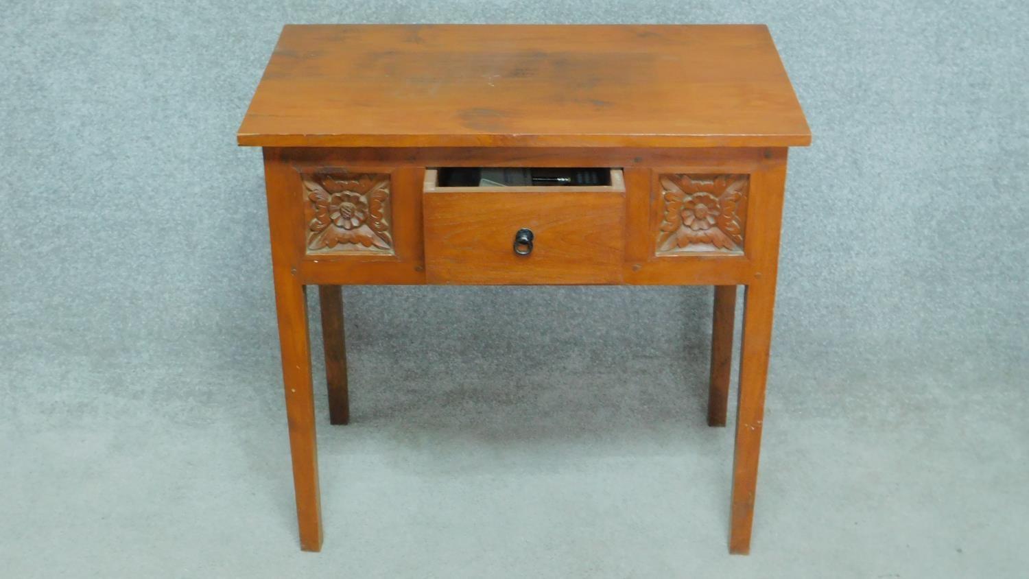 An Eastern teak side table fitted with frieze drawer flanked by floral carved panels on square - Image 3 of 4