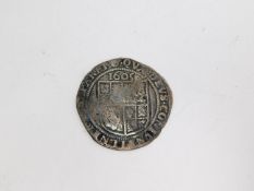 A Silver 6 Pence "James I" 1604 - 1605. Bust on one side and shield on the other. D.2.5cm