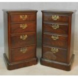 A pair of 19th century walnut chests of four graduating drawers on plinth bases. H.77 W.44 D.36cm