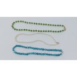 A blue cultured pearl necklace with silver ball push clasp, a serpentine and cultured pearl necklace