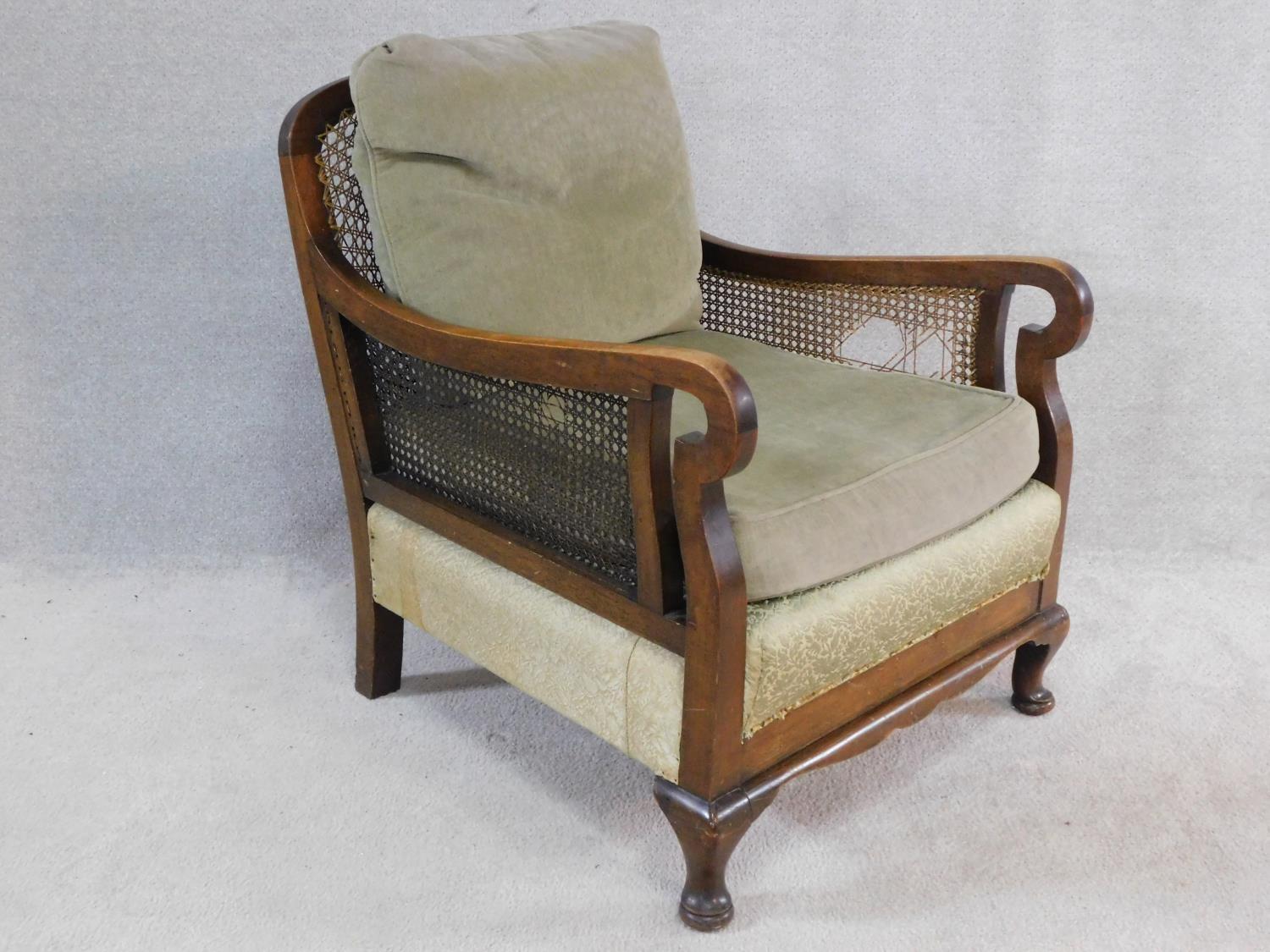 A mid century mahogany framed bergere armchair with squab cushions to seat and back. H.79 W.74 D. - Image 2 of 6