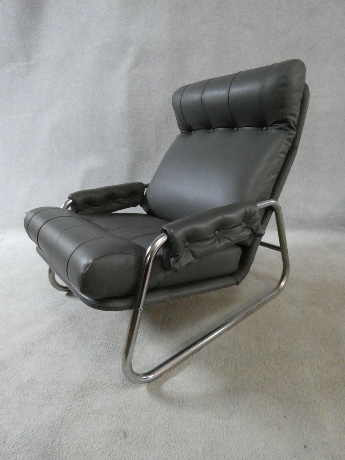 A vintage reclining armchair on chrome base in charcoal buttoned leather upholstery. H.82 W.65 D. - Image 3 of 9