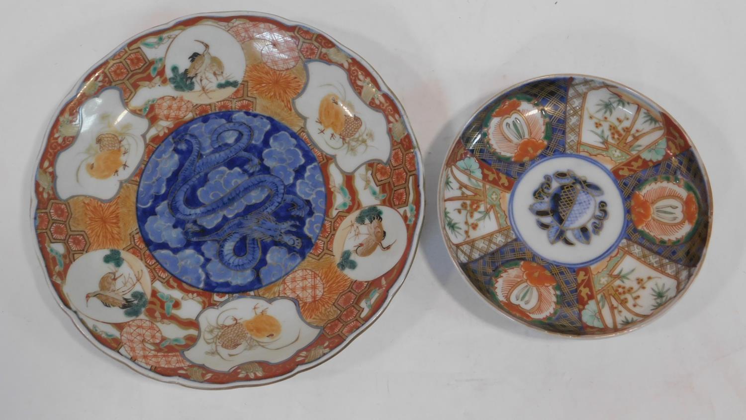 Two 19th century Arita Imari Japanese porcelain plates. One with six white cartouches, each hand