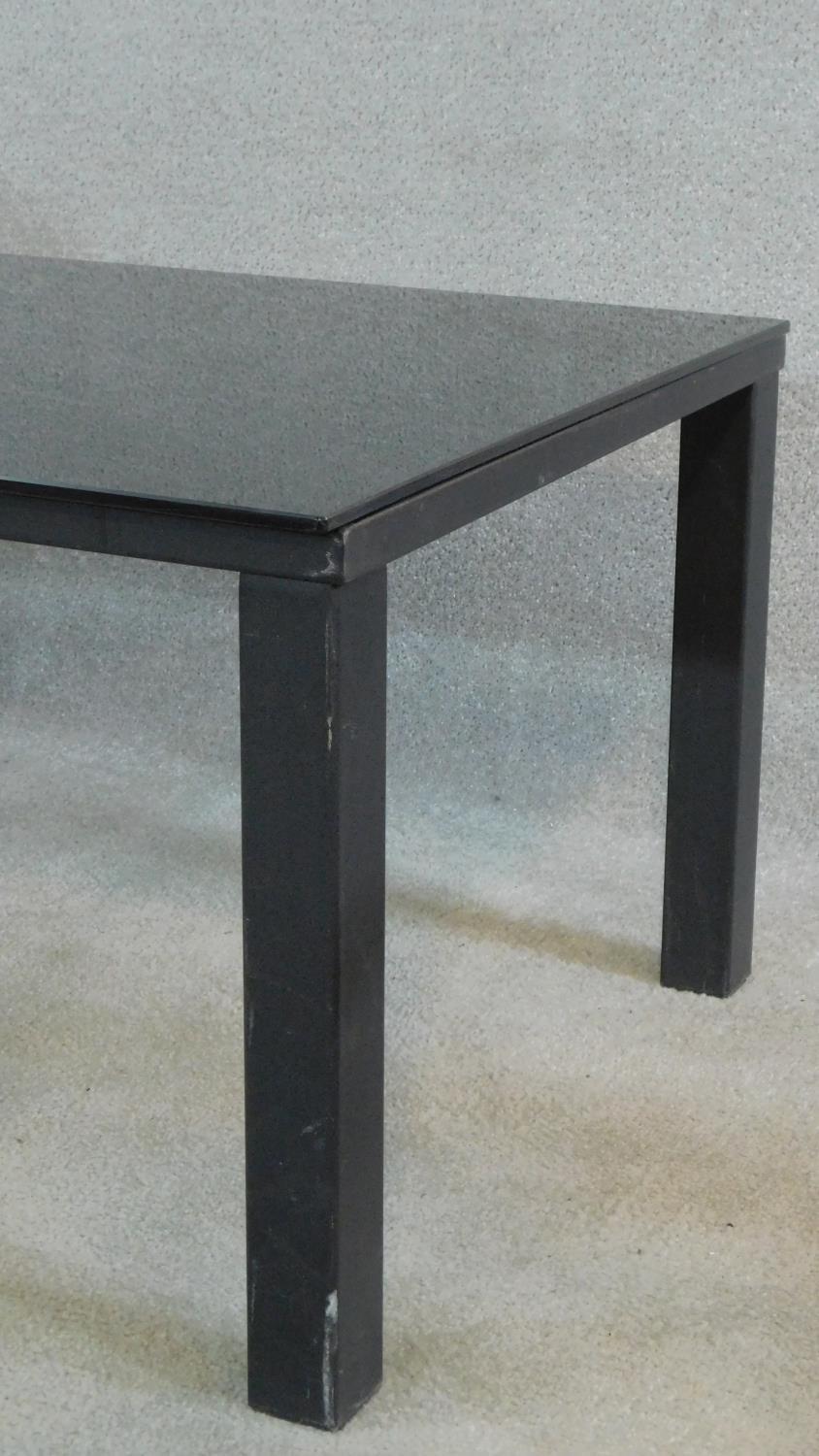 A contemporary low table with dark plate glass top on metal framed base. H.46 L.120 D.65cm - Image 3 of 5