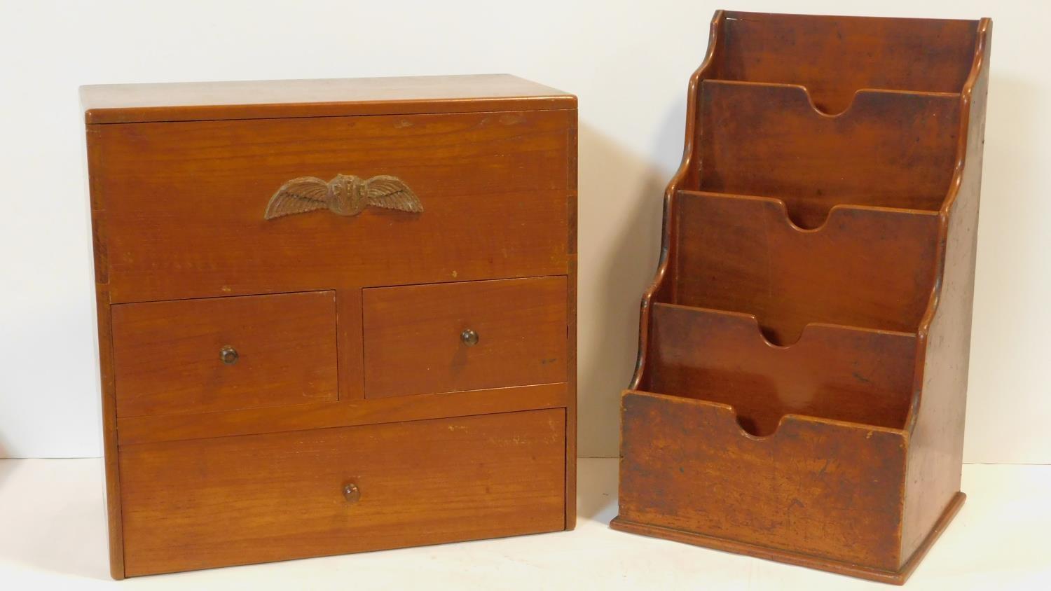 A vintage apothecary's chest with fitted interior and R.A.F. insignia carved to the frieze and a
