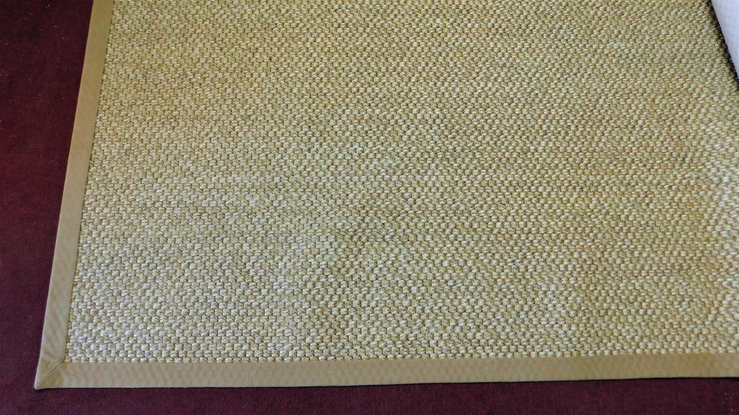 A large handmade sisal carpet by Stark of New York, makers label to the underside. L.419xW.366cm