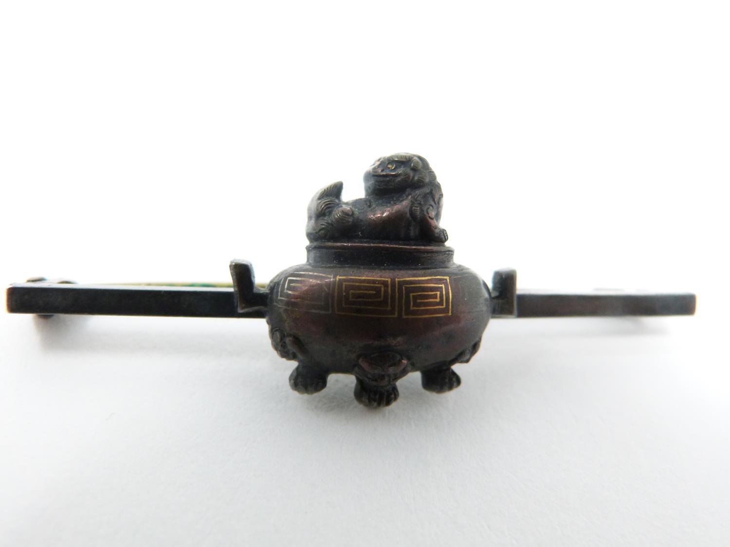 An antique bronze bar brooch with a mounted miniature two handled bronze censer with Buddhistic lion - Image 6 of 8