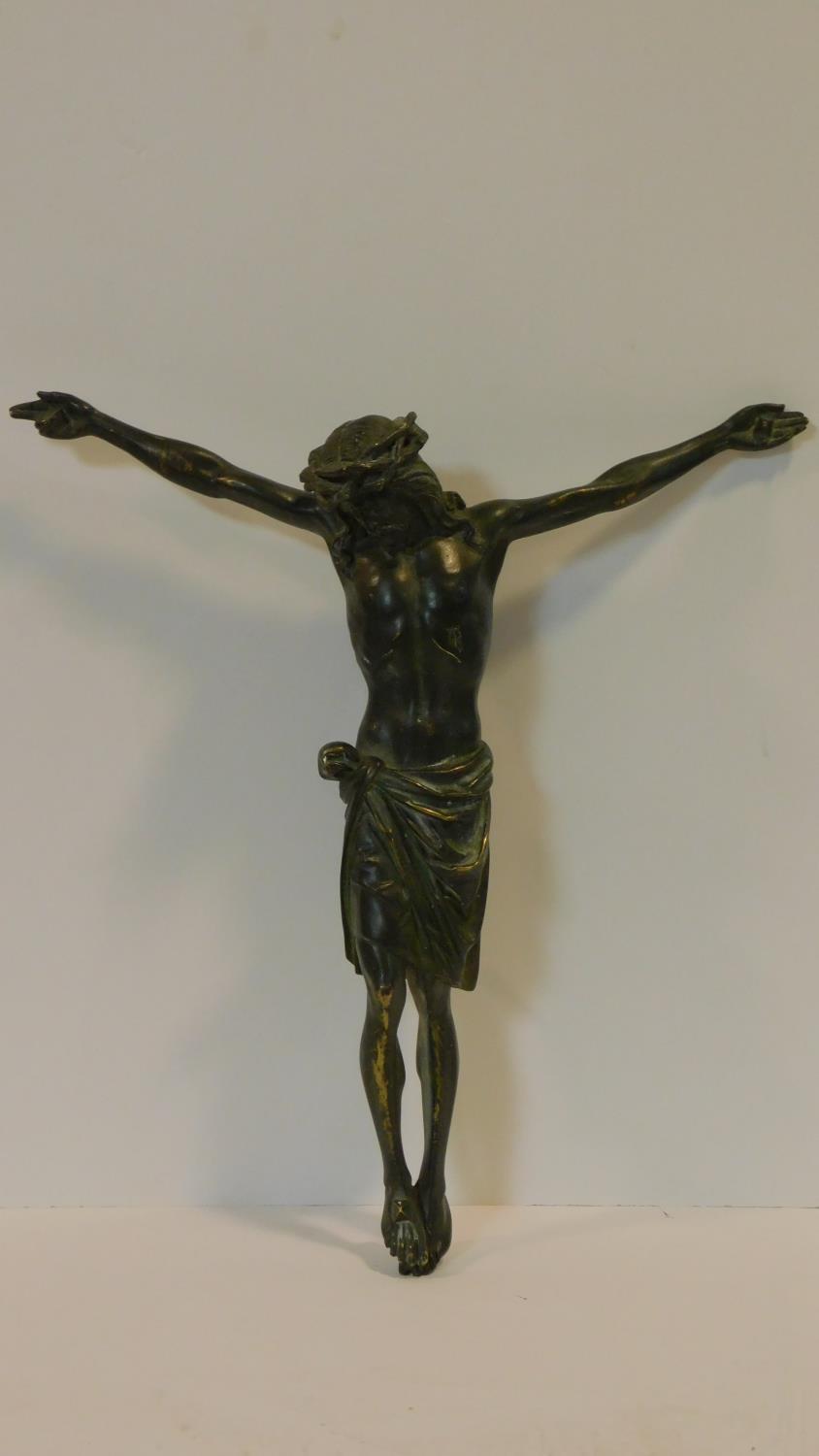 A patinated brass figure of the Crucifixion, intricately detailed. H.48cm