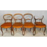 A set of four 19th century rosewood balloon back dining chairs on carved cabriole supports. H.86cm