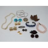 A collection of vintage jewellery. Including a pair of enamel gold plated geometric earrings, a pair