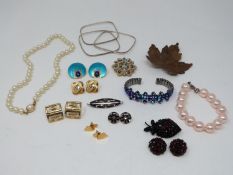 A collection of vintage jewellery. Including a pair of enamel gold plated geometric earrings, a pair