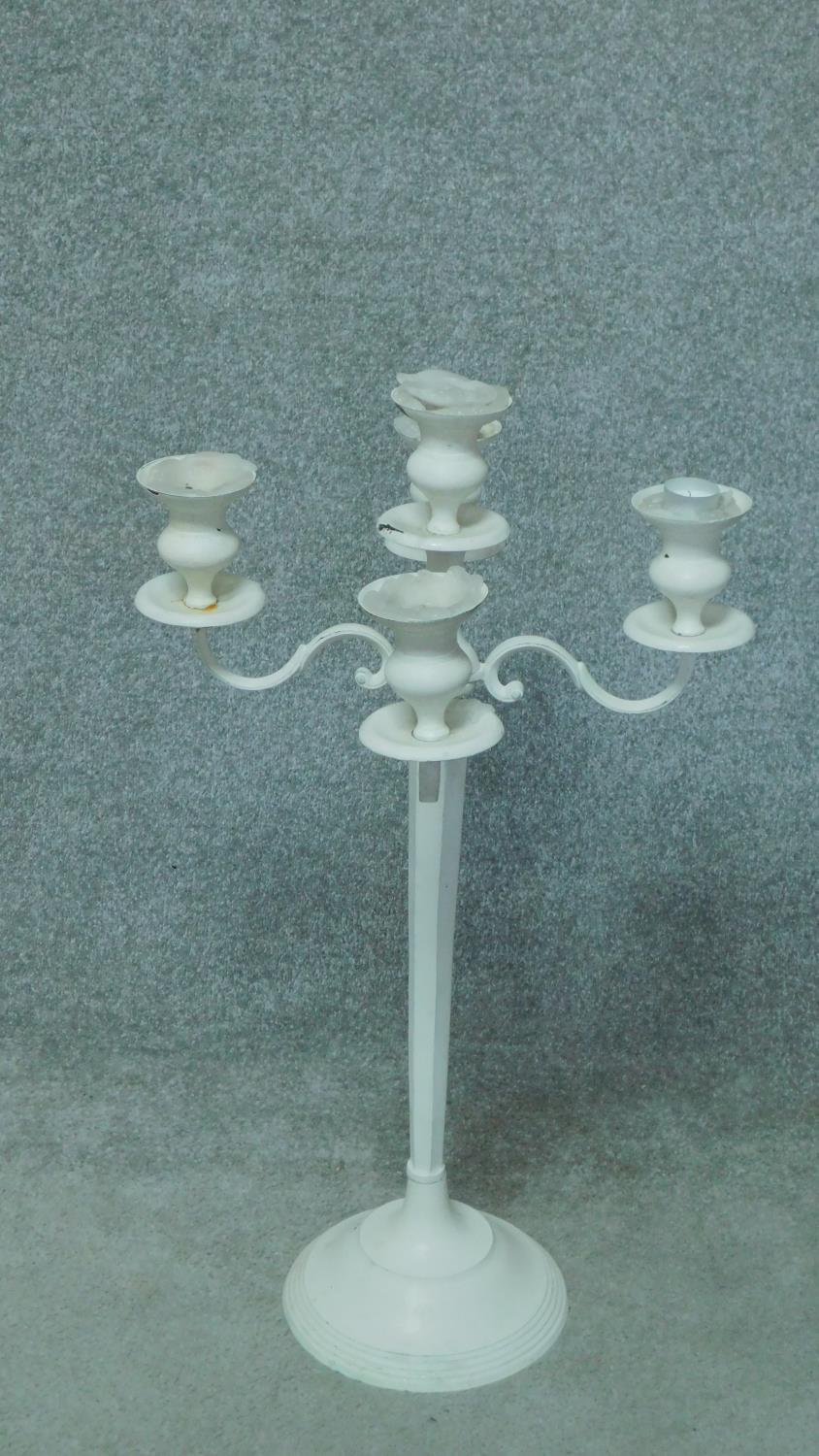 A pair of white painted metal five branch table candelabras. H.78cm - Image 2 of 4