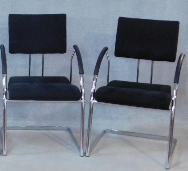 A pair of contemporary Martin Stoll boardroom armchairs on chrome cantilever supports. H.92cm
