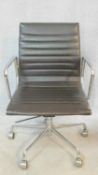 A vintage Charles and Ray Eames inspired Aluminium Group style office desk armchair in black