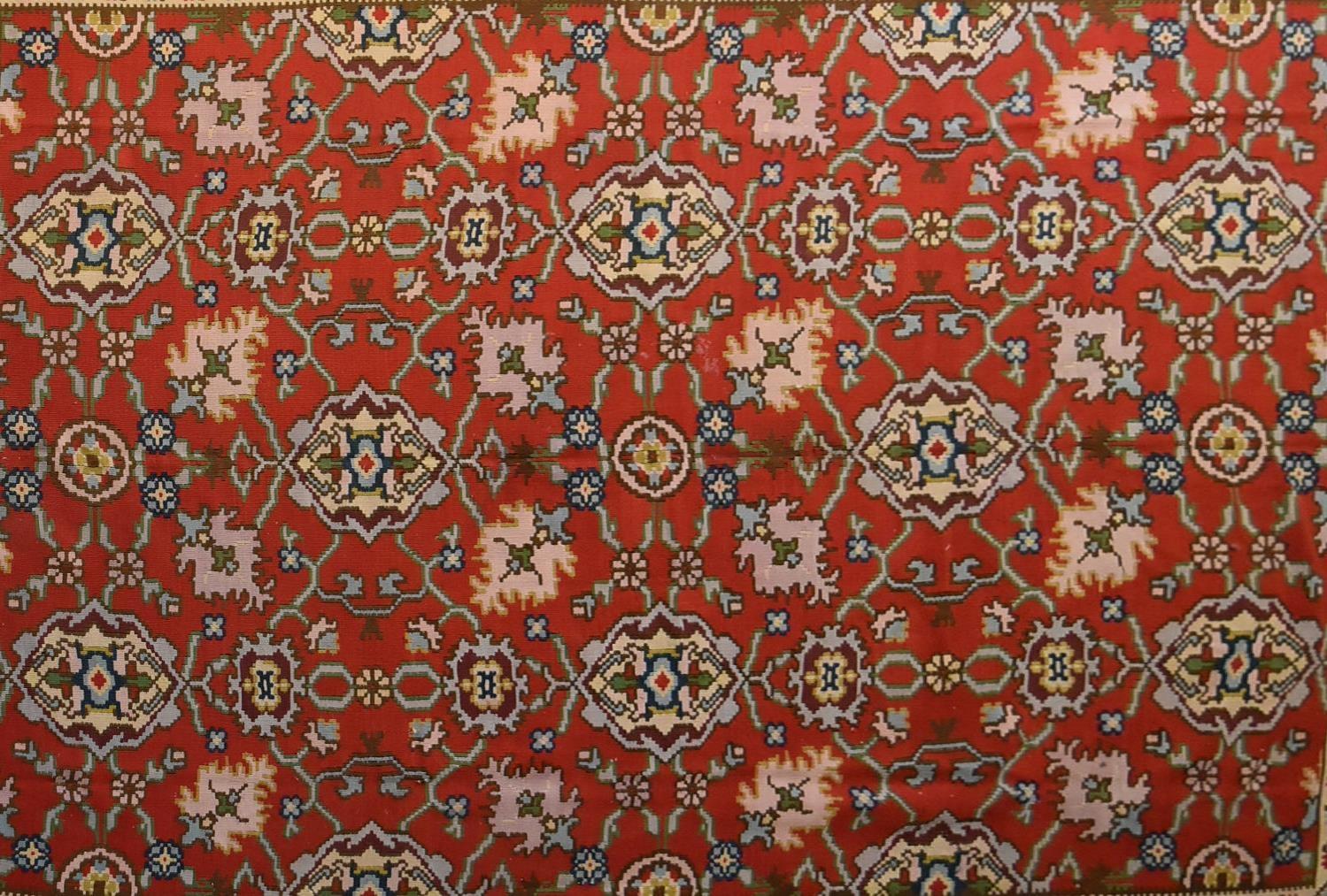 A Kilim with repeating scrolling floral design surrounded by an azure stylised flowerhead border. - Image 2 of 4