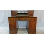 A 19th century mahogany Dicken's type pedestal desk with raised fitted superstructure with tooled