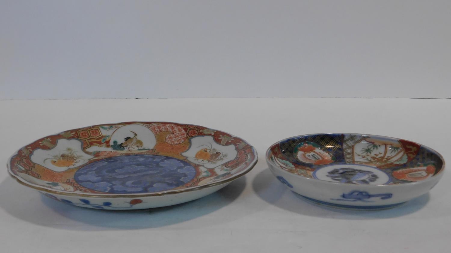 Two 19th century Arita Imari Japanese porcelain plates. One with six white cartouches, each hand - Image 2 of 7