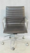 A vintage Charles and Ray Eames inspired Aluminium Group style office desk armchair in black