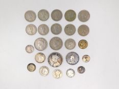 A collection of twenty four silver and white metal coins. Including silver sixpences, George VI