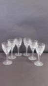 A set of six star cut heavy lead crystal small sherry glasses with star cut design to bases and