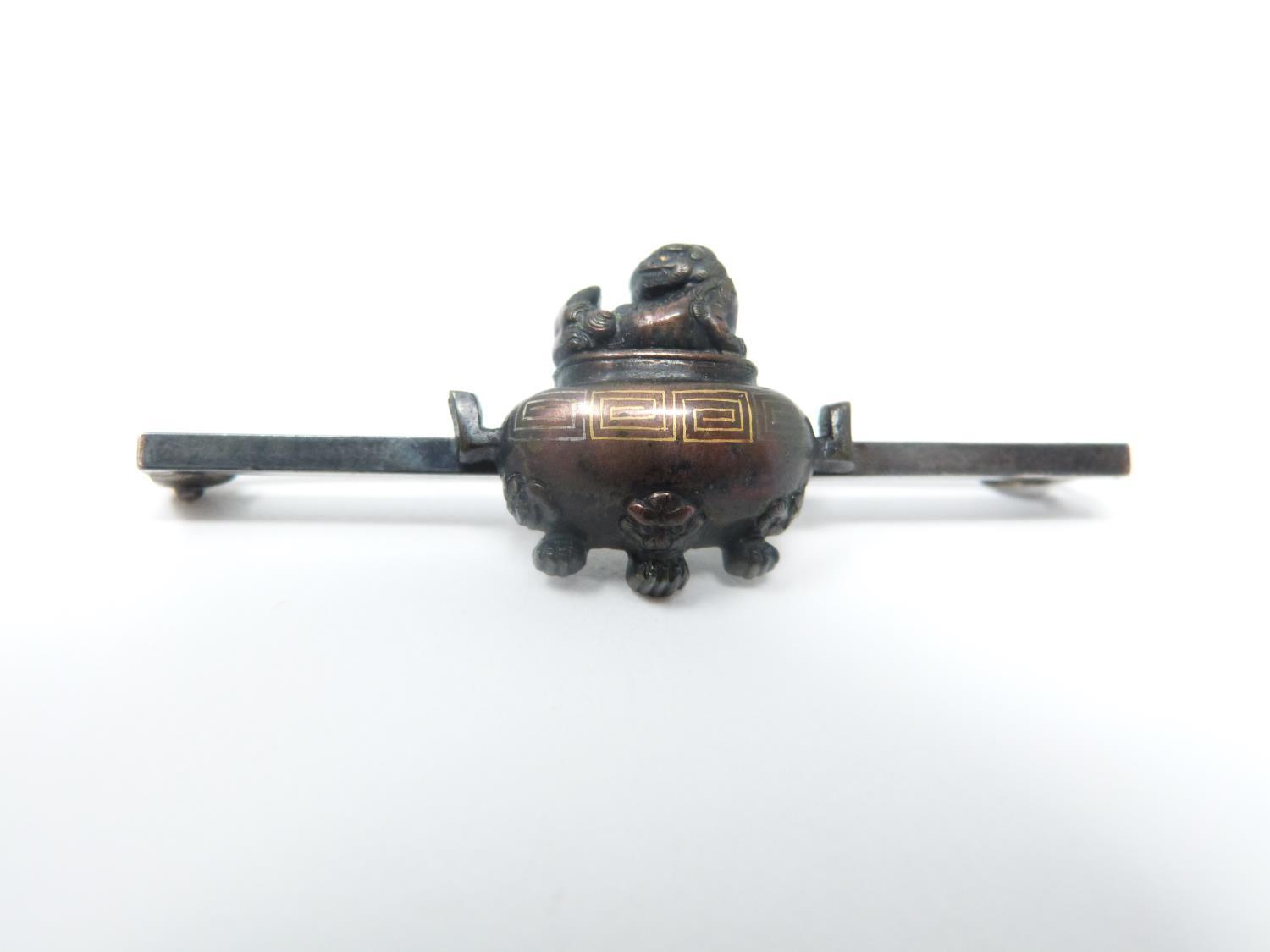 An antique bronze bar brooch with a mounted miniature two handled bronze censer with Buddhistic lion - Image 7 of 8