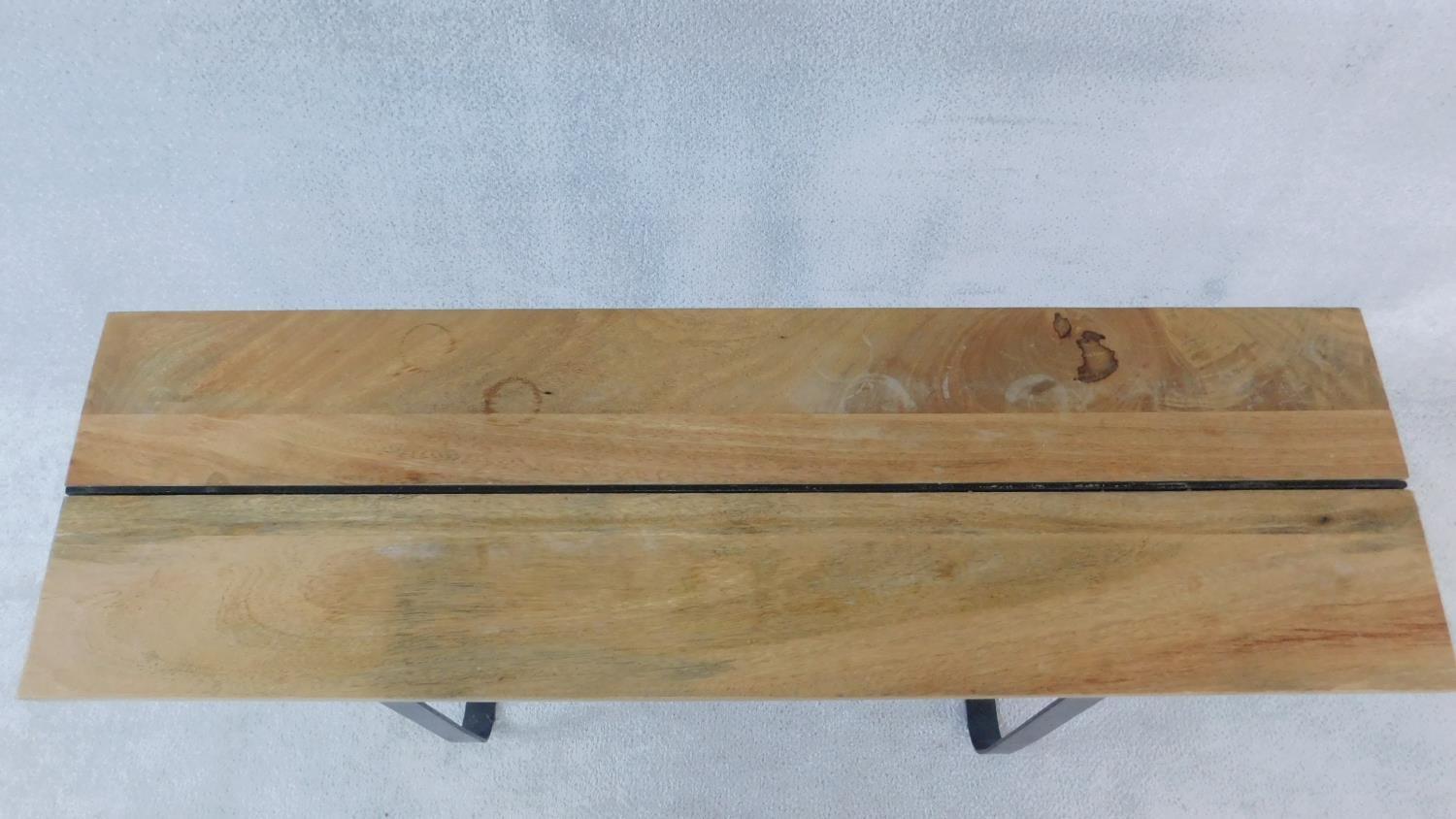 An Eastern hardwood planked top console table on wrought metal base. H.80 W.120 D.36cm - Image 2 of 2
