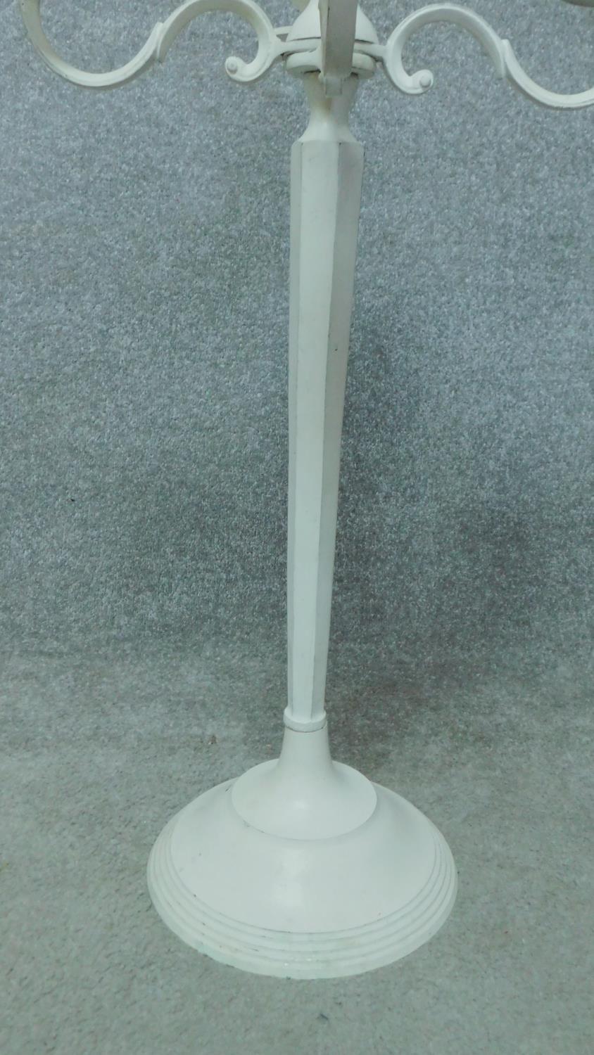 A pair of white painted metal five branch table candelabras. H.78cm - Image 4 of 4
