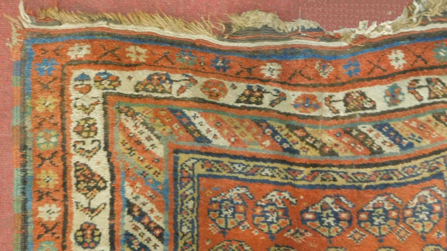 A Russian Kazakh runner with allover repeating stylised floral motifs on rouge ground contained - Image 4 of 4