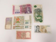 A collection of world bank notes. Including Bank of Central Ireland £1 and £10 notes, a Belgian