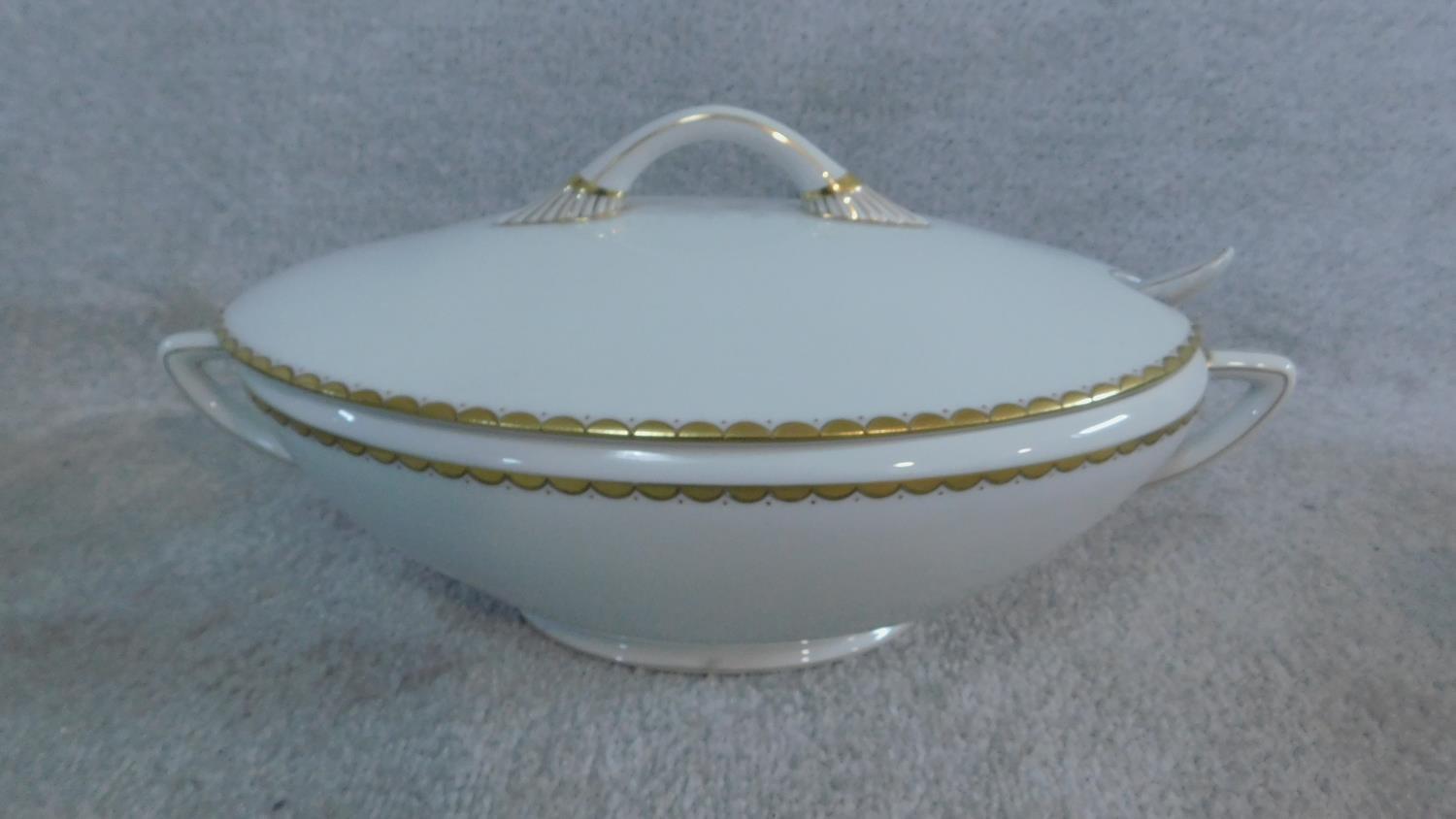 An extensive dinner service in white porcelain and gilt highlighted rims, marked Epiag, - Image 8 of 10