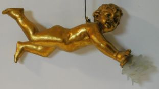 A gilded resin hanging lamp fitting in the form of a putti with frosted glass floral form shade. W.