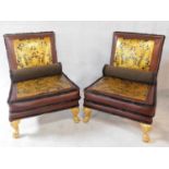 A pair of craftsman built salon chairs from the Pozzoli workshop upholstered in deep claret gilt