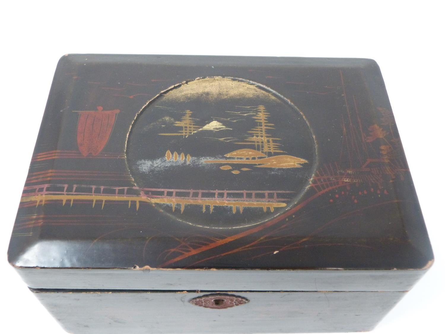 A Meji period Japanese gilt lacquer box with central circular cartouche with a mountain with a hut - Image 2 of 13