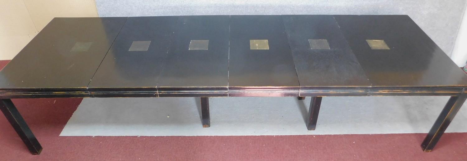 A Chinese ebonised and lacquered extending dining table with four extra leaves on square section - Image 2 of 4