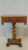 A 19th century mahogany occasional table with frieze drawer opposing dummy drawer on spiral twist