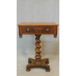A 19th century mahogany occasional table with frieze drawer opposing dummy drawer on spiral twist